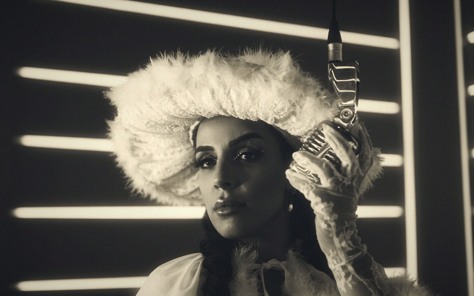 Woman in a fur hat holds a vintage microphone against striped neon light streaks