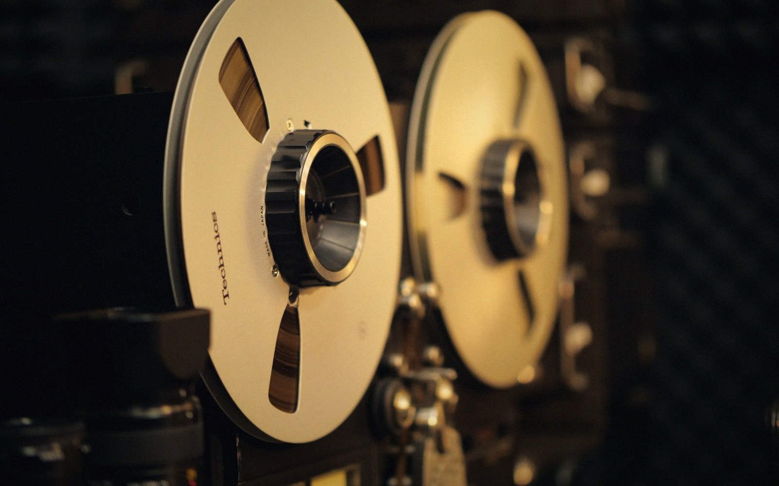 A long tape loop running across a room on stands